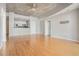 Open living room with hardwood floors showcasing the pass-through to the kitchen at 250 Pharr Ne Rd, Atlanta, GA 30305