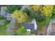 Overhead view of a charming home with a driveway surrounded by greenery, creating a private and serene setting at 307 Gordon Woods Sw Dr, Mableton, GA 30126
