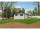 Spacious backyard with a freshly painted home and lush green lawn at 307 Gordon Woods Sw Dr, Mableton, GA 30126