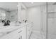 This modern bathroom features double sinks, beautiful countertop, glass shower enclosure, and neutral colors at 307 Gordon Woods Sw Dr, Mableton, GA 30126