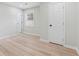 A bright bedroom with neutral walls and wood flooring offers a relaxing retreat with natural light and closet space at 307 Gordon Woods Sw Dr, Mableton, GA 30126
