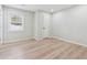 Bright bedroom features light wood flooring, a window, and neutral walls, creating a calming atmosphere at 307 Gordon Woods Sw Dr, Mableton, GA 30126