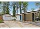 A carport is attached to the house near the detached garage at 307 Gordon Woods Sw Dr, Mableton, GA 30126