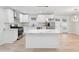 Modern kitchen with stainless steel appliances, white cabinets and a spacious island with countertops at 307 Gordon Woods Sw Dr, Mableton, GA 30126