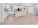 This open kitchen features modern white cabinets, stainless steel appliances, and a center island at 307 Gordon Woods Sw Dr, Mableton, GA 30126