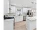 Bright eat in kitchen features stainless appliances, white cabinets, and an island with marble countertops at 307 Gordon Woods Sw Dr, Mableton, GA 30126