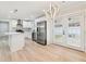 Modern kitchen boasts stainless steel appliances, an island, and stylish lighting fixtures at 307 Gordon Woods Sw Dr, Mableton, GA 30126