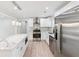 Beautiful kitchen features stainless steel appliances, a kitchen island and sleek pendant lighting at 307 Gordon Woods Sw Dr, Mableton, GA 30126