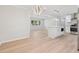 Bright kitchen boasts stainless steel appliances, white cabinetry, and center island with modern lighting at 307 Gordon Woods Sw Dr, Mableton, GA 30126