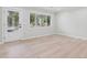 Bright room featuring hardwood floors, natural light, and access to the exterior at 307 Gordon Woods Sw Dr, Mableton, GA 30126