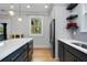 Bright kitchen featuring stainless steel appliances and an island with a white countertop at 3172 Chapel St, Scottdale, GA 30079