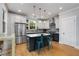 Spacious kitchen with an island, stainless steel appliances, and ample cabinet space at 3172 Chapel St, Scottdale, GA 30079