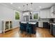 Open kitchen featuring stainless steel appliances, a center island and a view of the backyard at 3172 Chapel St, Scottdale, GA 30079
