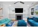 Cozy living room featuring a fireplace, built-in shelving, and modern decor at 3172 Chapel St, Scottdale, GA 30079