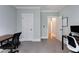 Spacious office with gray carpet, bright light, and access to other rooms in the home at 3172 Chapel St, Scottdale, GA 30079