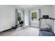 Home gym includes a treadmill, rowing machine, and large windows for plenty of light at 3172 Chapel St, Scottdale, GA 30079