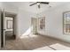 This bedroom features neutral paint, carpet and trim with natural light and a ceiling fan at 400 Stone Lea Trce, Oxford, GA 30054