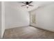The bedroom features neutral paint, carpet and trim with a ceiling fan at 400 Stone Lea Trce, Oxford, GA 30054