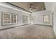 Bright bedroom with tray ceilings, carpet, and large windows at 400 Stone Lea Trce, Oxford, GA 30054