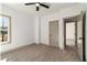 This bedroom features a ceiling fan and neutral-toned walls and carpet at 400 Stone Lea Trce, Oxford, GA 30054