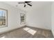 The bedroom has large windows and neutral carpet at 400 Stone Lea Trce, Oxford, GA 30054