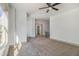 The bonus room features neutral paint and carpet with a large window for natural light at 400 Stone Lea Trce, Oxford, GA 30054