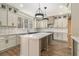 Beautiful open kitchen boasts a center island, granite countertops, custom cabinets, and stainless steel appliances at 400 Stone Lea Trce, Oxford, GA 30054