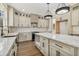 Bright kitchen featuring a large island, granite countertops, custom cabinets, and stainless steel appliances at 400 Stone Lea Trce, Oxford, GA 30054