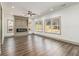 Bright living room features a fireplace, wood floors, and large windows at 400 Stone Lea Trce, Oxford, GA 30054