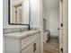 This powder room has granite countertops and modern fixtures at 400 Stone Lea Trce, Oxford, GA 30054