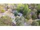 Aerial view of a home nestled among lush trees in a suburban neighborhood at 175 W Station Nw Dr, Kennesaw, GA 30144