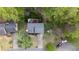 Aerial view of home with deck and play set. Surrounded by lush trees at 175 W Station Nw Dr, Kennesaw, GA 30144
