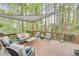 Inviting back deck featuring comfortable seating, wooden railing, and a stylish sunshade at 175 W Station Nw Dr, Kennesaw, GA 30144
