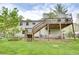 Exterior view of backyard featuring a multi-level deck and lush green lawn at 175 W Station Nw Dr, Kennesaw, GA 30144