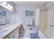 A bright bathroom with a large mirror and vanity and shower/tub combo at 175 W Station Nw Dr, Kennesaw, GA 30144