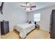 Cozy bedroom with a ceiling fan, and neutral decor, offers a warm, relaxing retreat at 175 W Station Nw Dr, Kennesaw, GA 30144