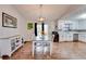 This bright kitchen and dining area include modern cabinetry, stainless steel appliances, and lots of natural light at 175 W Station Nw Dr, Kennesaw, GA 30144