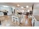This open concept living room features a seamless flow to the kitchen and dining area with lots of natural light at 175 W Station Nw Dr, Kennesaw, GA 30144