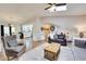 Open-concept home with living room, dining area, and kitchen with hardwood floors and natural light at 175 W Station Nw Dr, Kennesaw, GA 30144