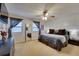 Comfortable main bedroom features a ceiling fan, wall paneling and large windows for natural light at 175 W Station Nw Dr, Kennesaw, GA 30144