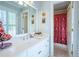 Bright bathroom featuring stylish shower curtain, and white vanity with great lighting at 225 Ansley Close, Roswell, GA 30075