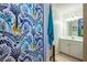 Bright bathroom featuring stylish shower curtain, and white vanity with great lighting at 225 Ansley Close, Roswell, GA 30075