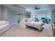 Bedroom with a large sofa, ceiling fan, carpet flooring, and home office setup at 225 Ansley Close, Roswell, GA 30075