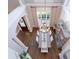 Open foyer and dining room with elegant chandelier and large windows providing lots of natural light at 225 Ansley Close, Roswell, GA 30075