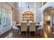 Formal dining room with hardwood floors, a chandelier, and large windows at 225 Ansley Close, Roswell, GA 30075