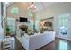 Bright living room with vaulted ceilings, a fireplace, hardwood floors, and backyard views at 225 Ansley Close, Roswell, GA 30075