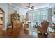 Bright living room with hardwood floors, a fireplace, and large windows overlooking the backyard at 225 Ansley Close, Roswell, GA 30075