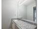 Bathroom featuring a granite countertop vanity, sleek mirror, and neutral paint at 3019 Havenwood Way, Stonecrest, GA 30038