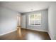 Bright bedroom with hardwood floors, a large window, and fresh, neutral paint at 3019 Havenwood Way, Stonecrest, GA 30038