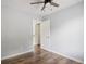 Bedroom showcasing hardwood floors, ceiling fan, and an adjoining doorway at 3019 Havenwood Way, Stonecrest, GA 30038